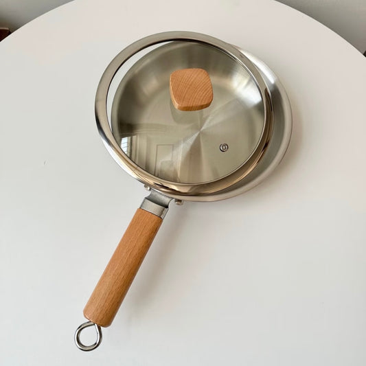 Uncoated wooden-handle frying pan