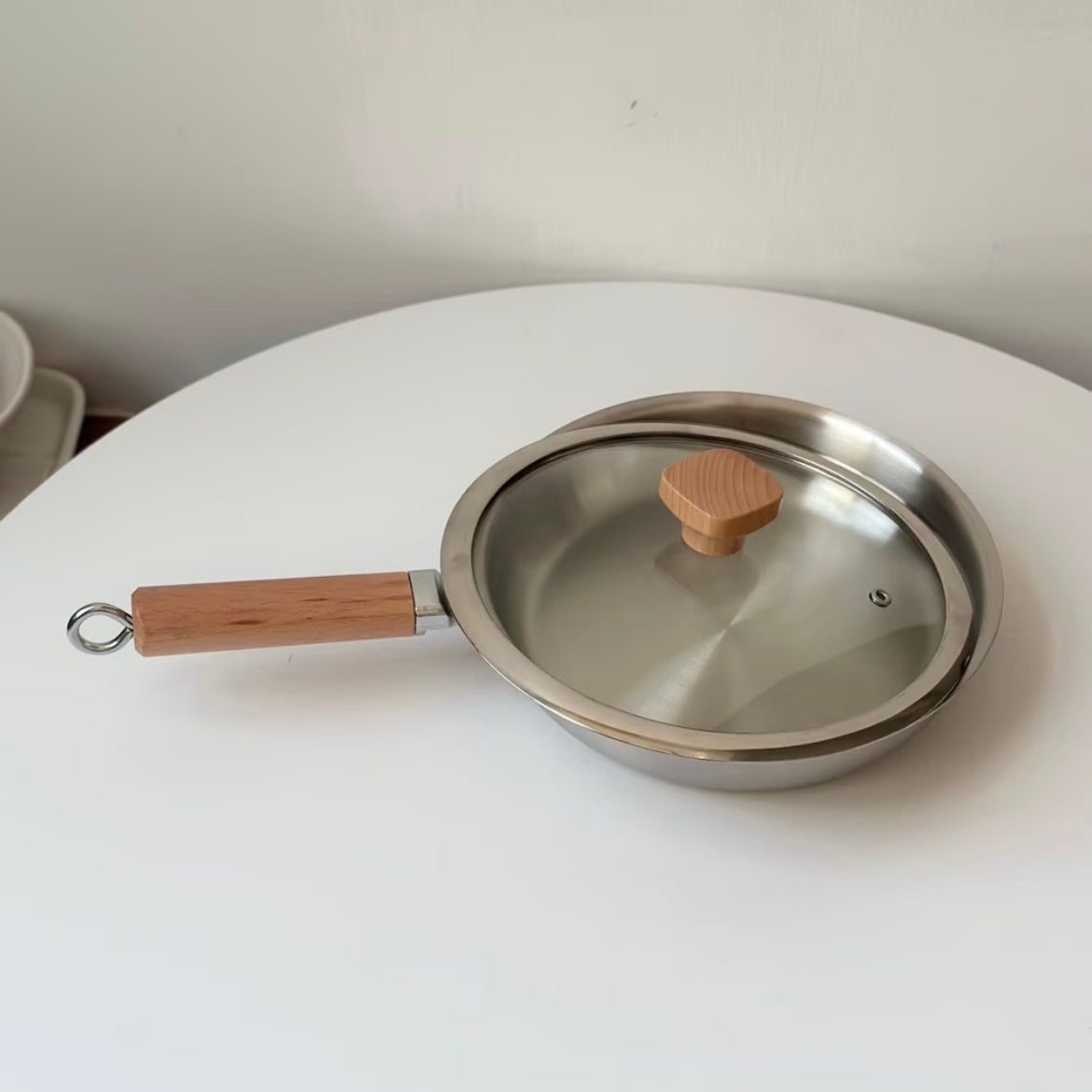 Uncoated wooden-handle frying pan
