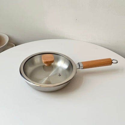 Uncoated wooden-handle frying pan